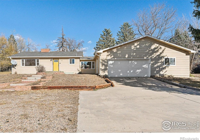 single story home featuring a garage