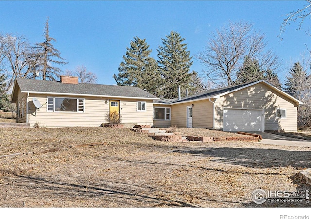 ranch-style home featuring a garage