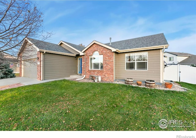 view of front facade with a garage and a front lawn