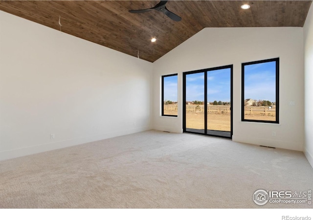 unfurnished room with light colored carpet, ceiling fan, a healthy amount of sunlight, and wood ceiling