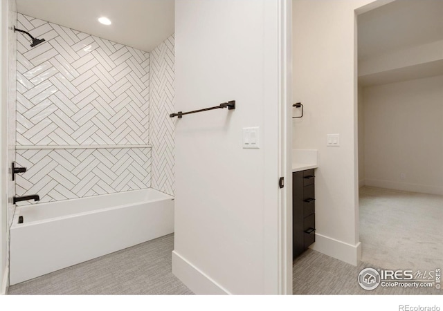 bathroom featuring vanity and tiled shower / bath combo