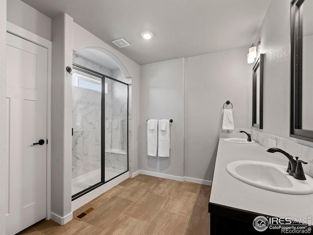 bathroom with vanity and walk in shower