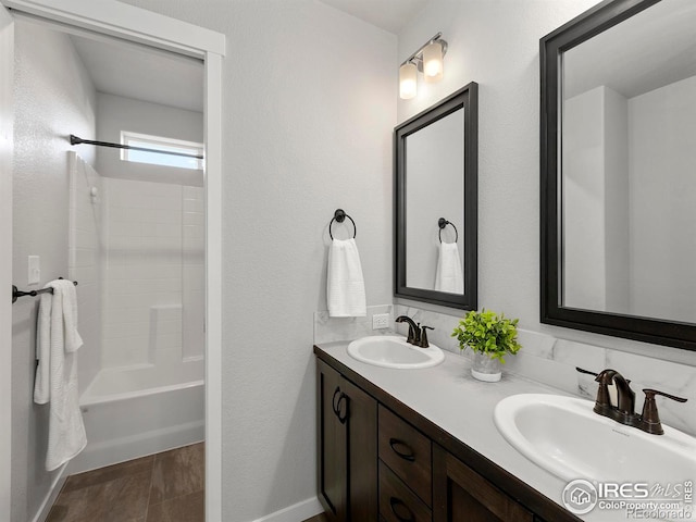 bathroom featuring vanity and bathing tub / shower combination