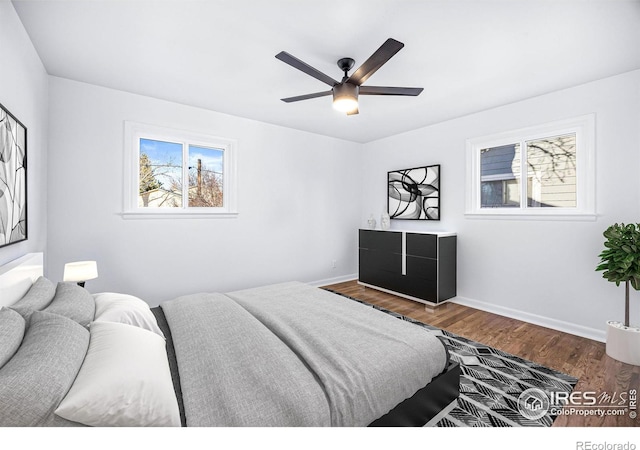 bedroom with ceiling fan and wood-type flooring