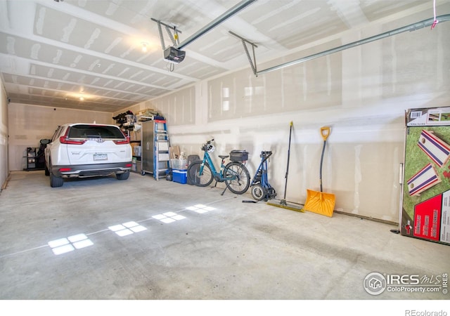 garage featuring a garage door opener