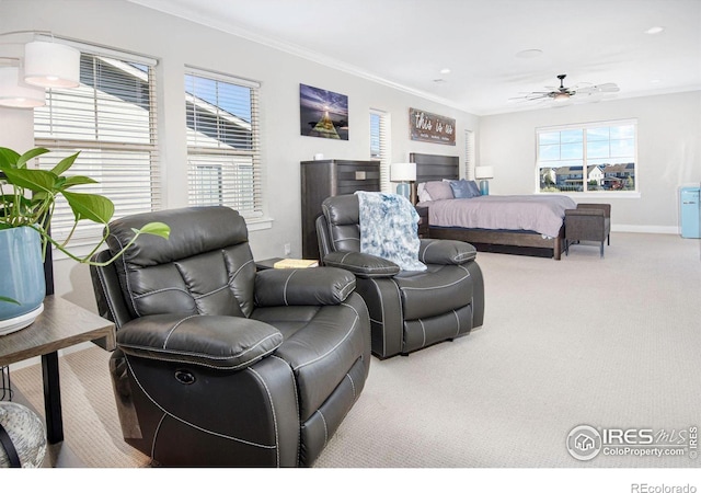 bedroom featuring crown molding, light colored carpet, and multiple windows