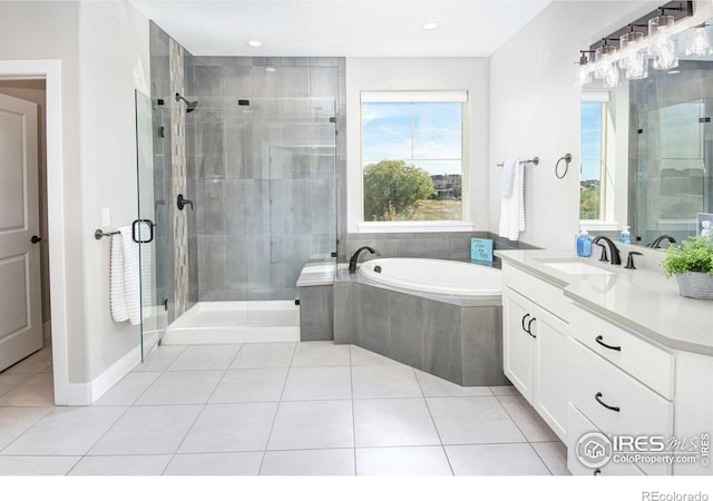 bathroom featuring vanity, tile patterned flooring, and plus walk in shower