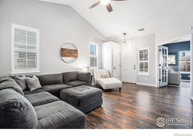 living room featuring ceiling fan, dark wood-type flooring, and high vaulted ceiling