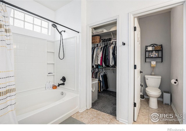 bathroom featuring tile patterned floors, toilet, and shower / bathtub combination with curtain