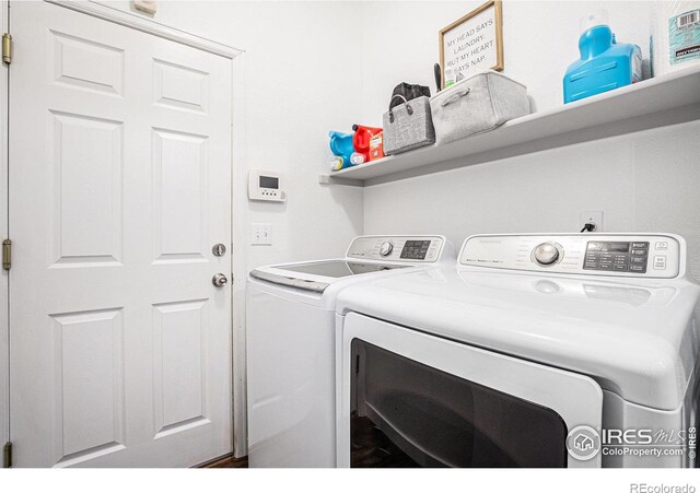 laundry area with independent washer and dryer