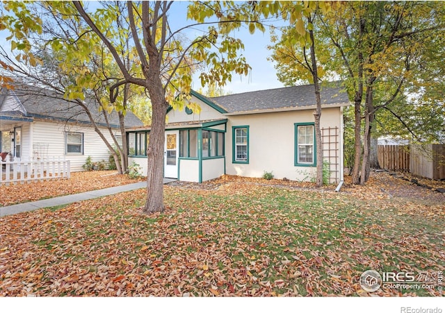 view of front of property with a sunroom