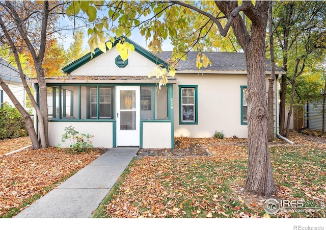 view of front of home with a sunroom