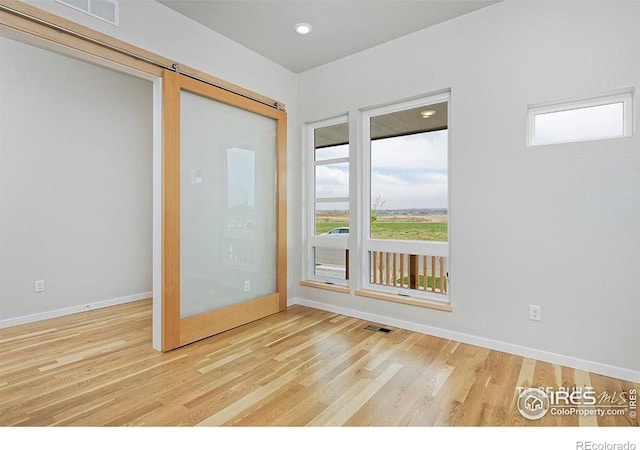 entryway with hardwood / wood-style floors