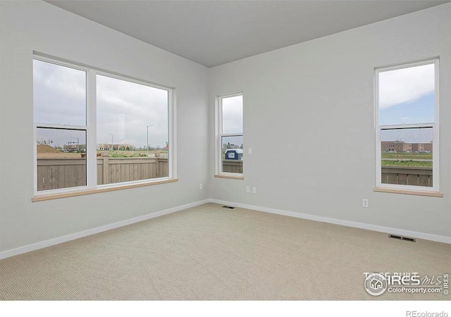 empty room with carpet flooring