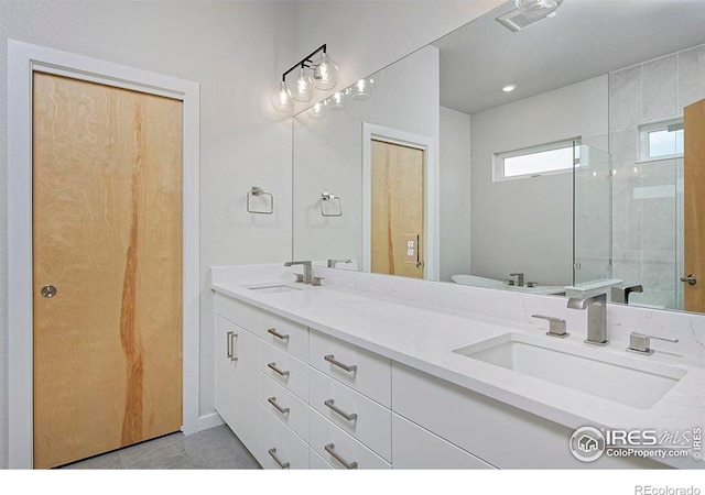 bathroom with vanity and walk in shower