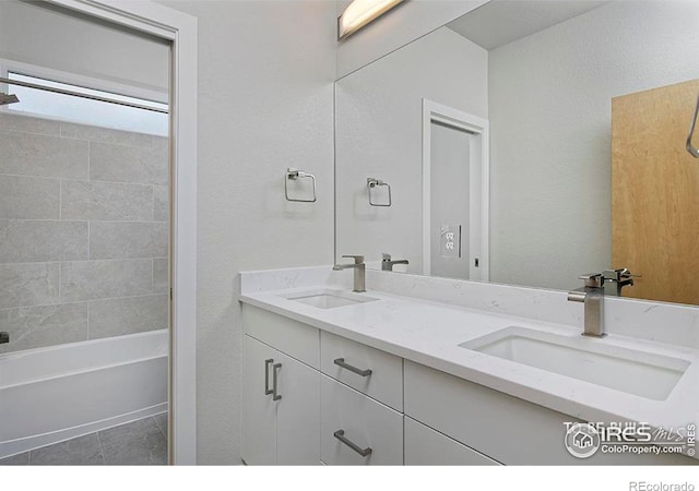 bathroom featuring tile patterned flooring, vanity, and shower / bath combination