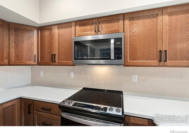 kitchen featuring backsplash and stainless steel appliances