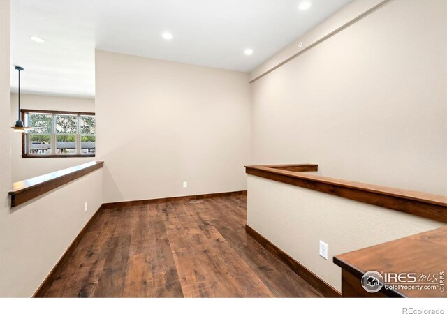 spare room featuring dark hardwood / wood-style floors