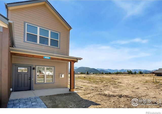 entrance to property with a mountain view