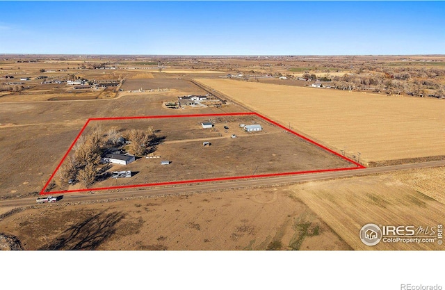 birds eye view of property with a rural view