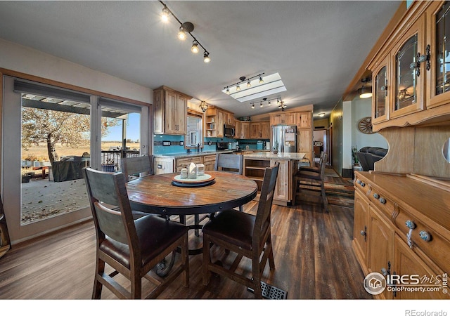 dining room with dark hardwood / wood-style flooring