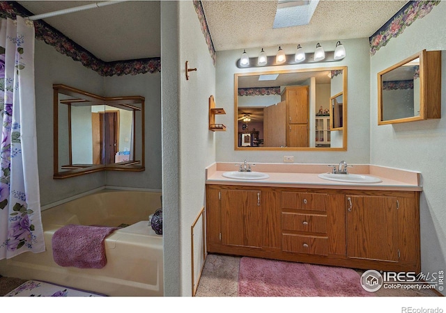 bathroom featuring vanity and a textured ceiling