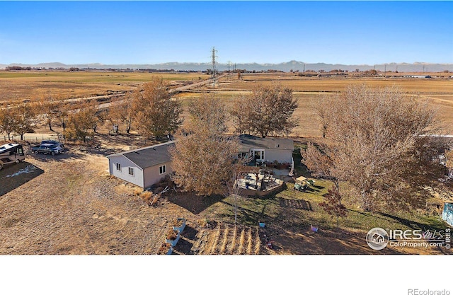 aerial view featuring a mountain view and a rural view