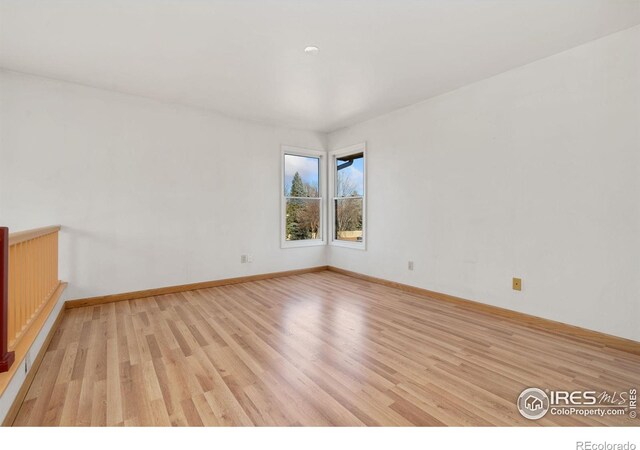 empty room with light hardwood / wood-style floors