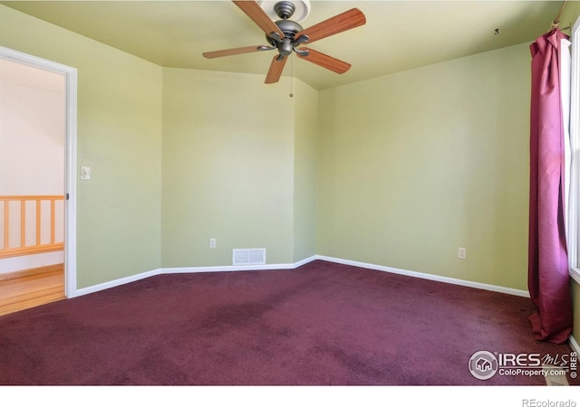 carpeted empty room featuring ceiling fan