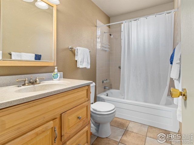 full bathroom featuring vanity, toilet, tile patterned flooring, and shower / bath combo