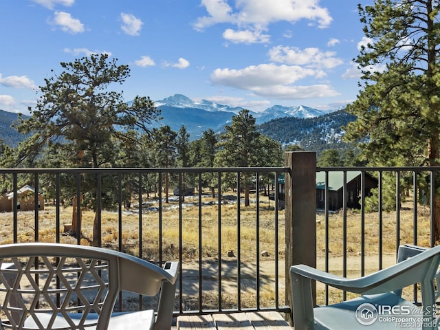 balcony featuring a mountain view