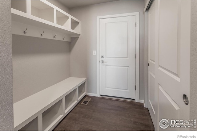 6105 Saddle Horn Dr, Timnath, CO 80547 - mudroom with dark wood-type flooring and baseboards