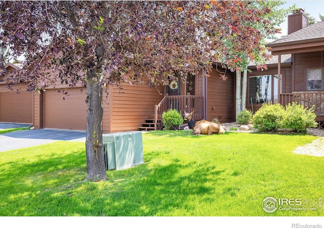 view of yard with a garage