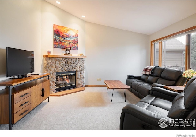 living room featuring light carpet, a fireplace, and lofted ceiling