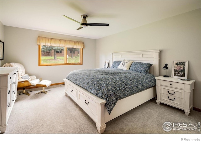 carpeted bedroom featuring ceiling fan