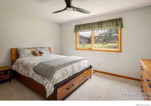 bedroom featuring ceiling fan and light colored carpet