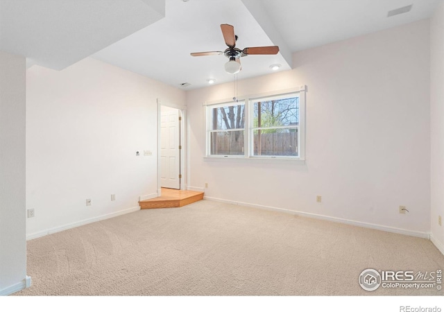 spare room with ceiling fan and carpet floors