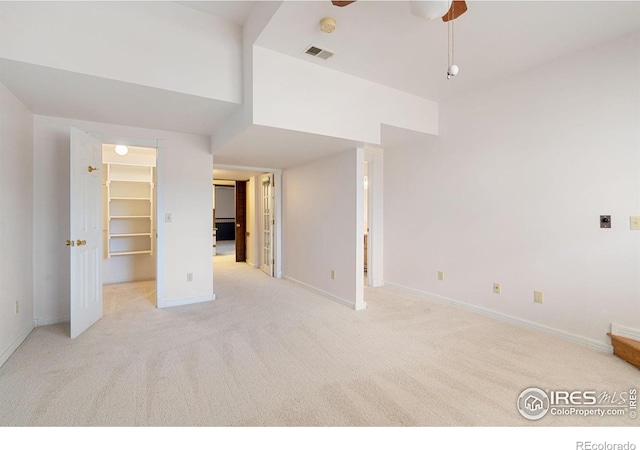 carpeted empty room with ceiling fan