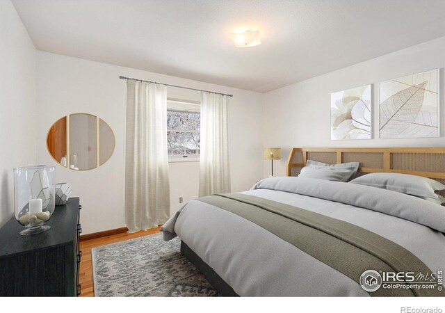 bedroom featuring hardwood / wood-style flooring