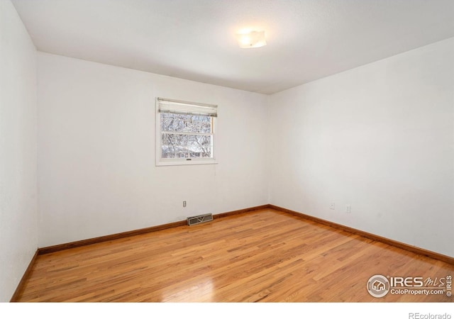 unfurnished room featuring light hardwood / wood-style floors