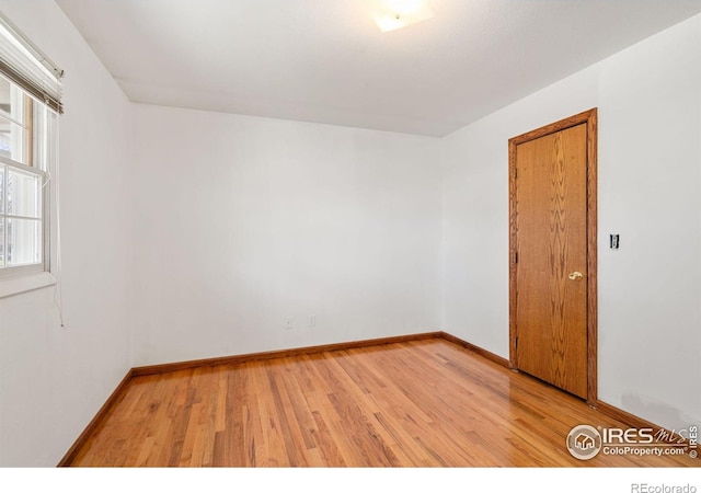 spare room featuring light hardwood / wood-style floors