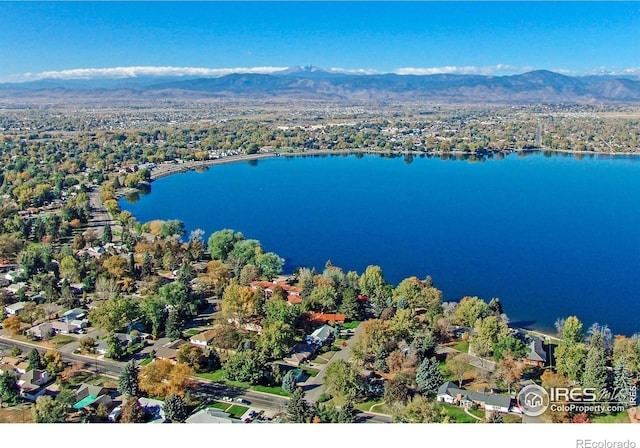 birds eye view of property featuring a water and mountain view