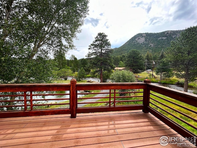 wooden terrace with a mountain view