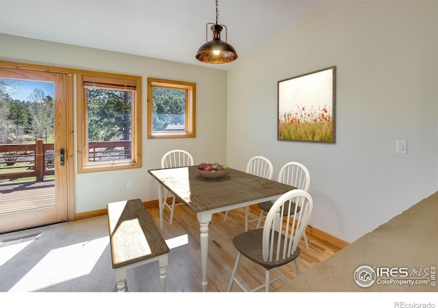 dining space featuring light wood-type flooring