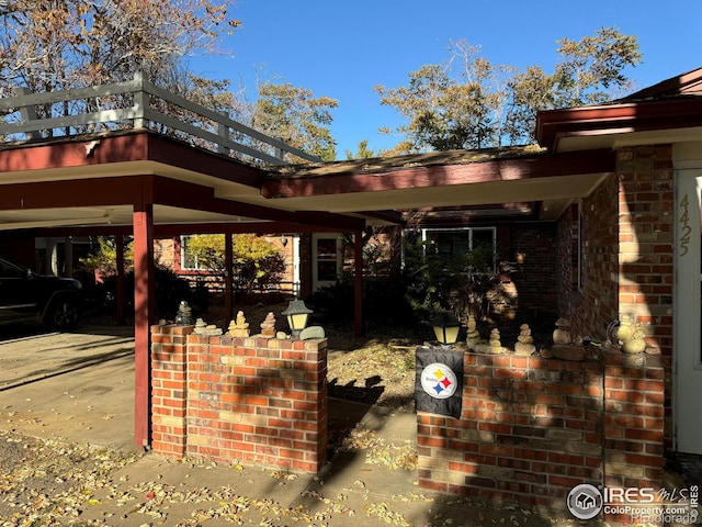 view of patio / terrace featuring a carport