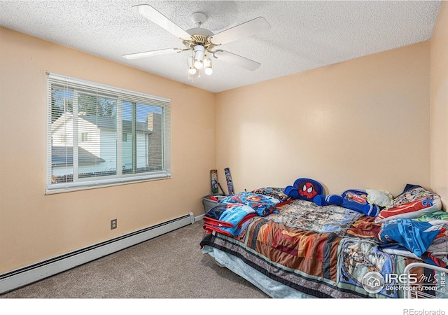 bedroom with a baseboard heating unit, carpet floors, a textured ceiling, and a ceiling fan