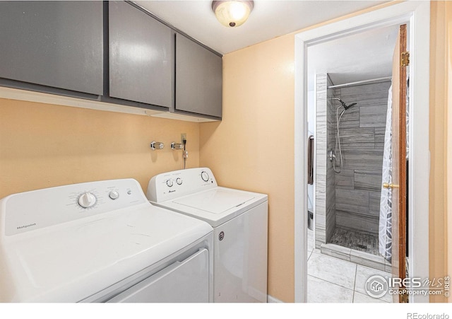 laundry room featuring cabinet space and washing machine and dryer