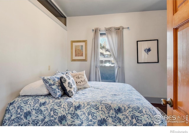 bedroom featuring wood-type flooring