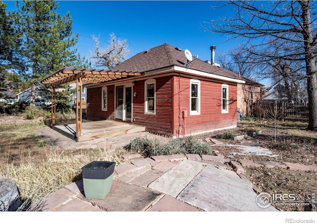 back of house featuring a pergola and a patio