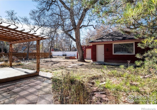 view of yard featuring a pergola and a wooden deck